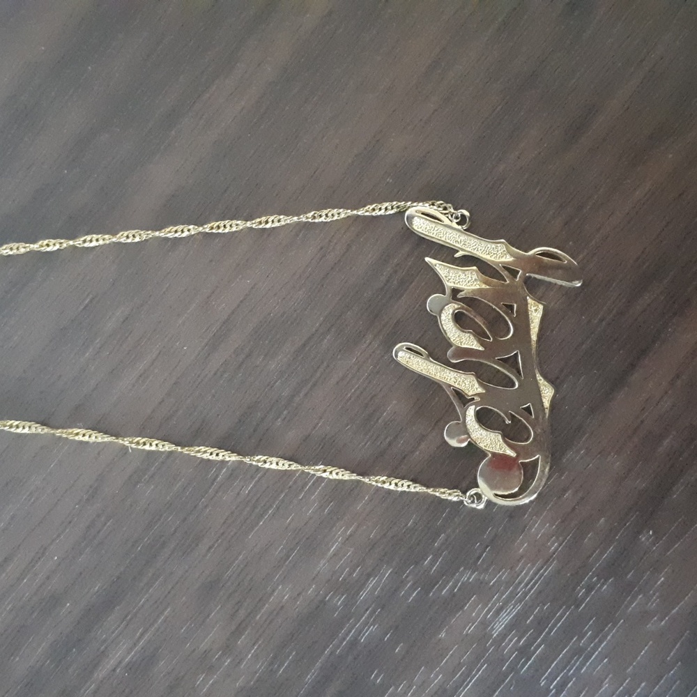 Gold Tone Obey Necklace